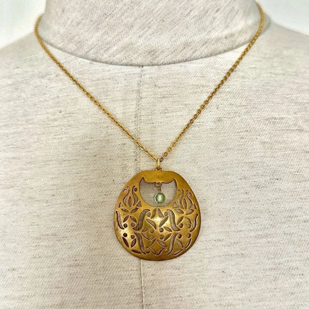 Gold tone pendant necklace
